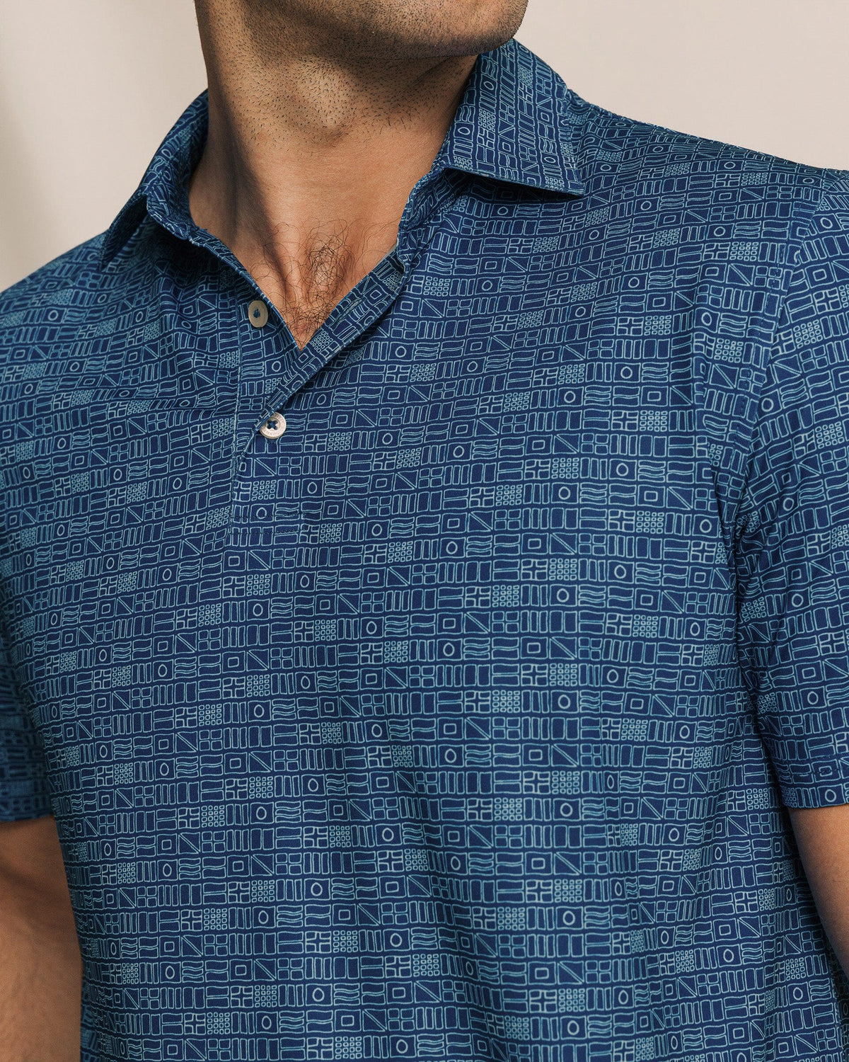 The detail view of the Southern Tide Driver ST Nautical Flag Printed Polo by Southern Tide - Nautical Blue