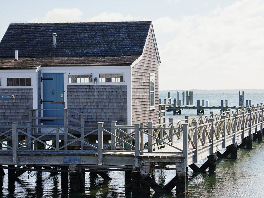 Nantucket building on a dock overlooking the water.