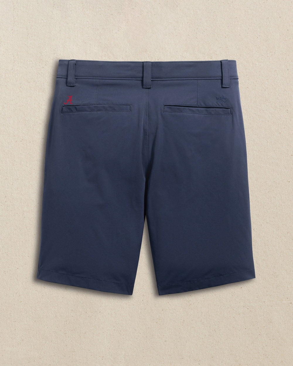 The back view of the Southern Tide Alabama Crimson Tide brrr°®-die 8" Performance Short by Southern Tide - True Navy