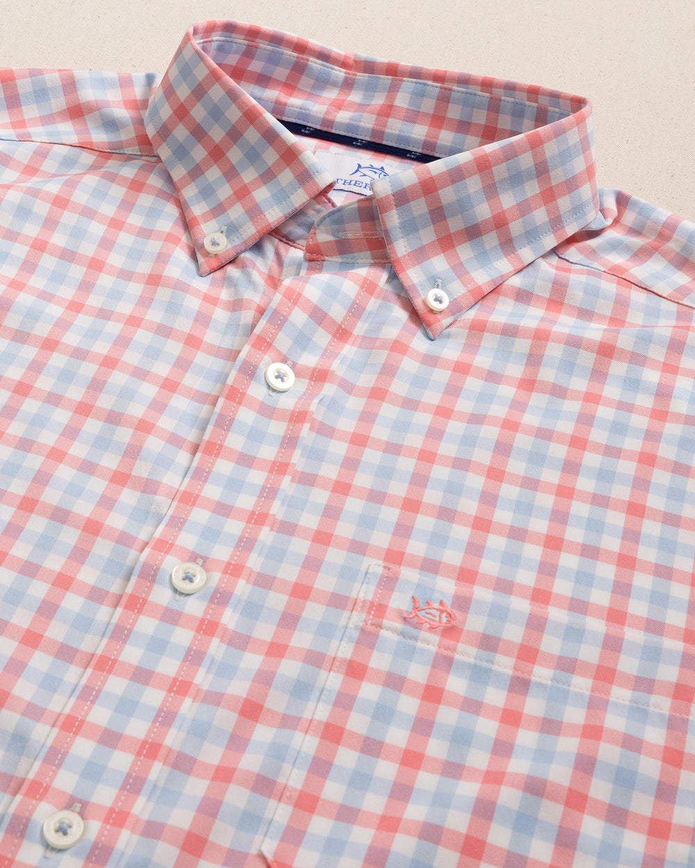 The detail view of the Southern Tide Albemarle Gingham brrr°® Intercoastal Sport Shirt by Southern Tide - Sunkist Coral