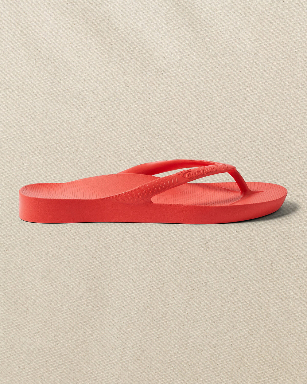 The right side view of the Southern Tide Archie's Coral Arch Support Flip Flop by Southern Tide - Coral