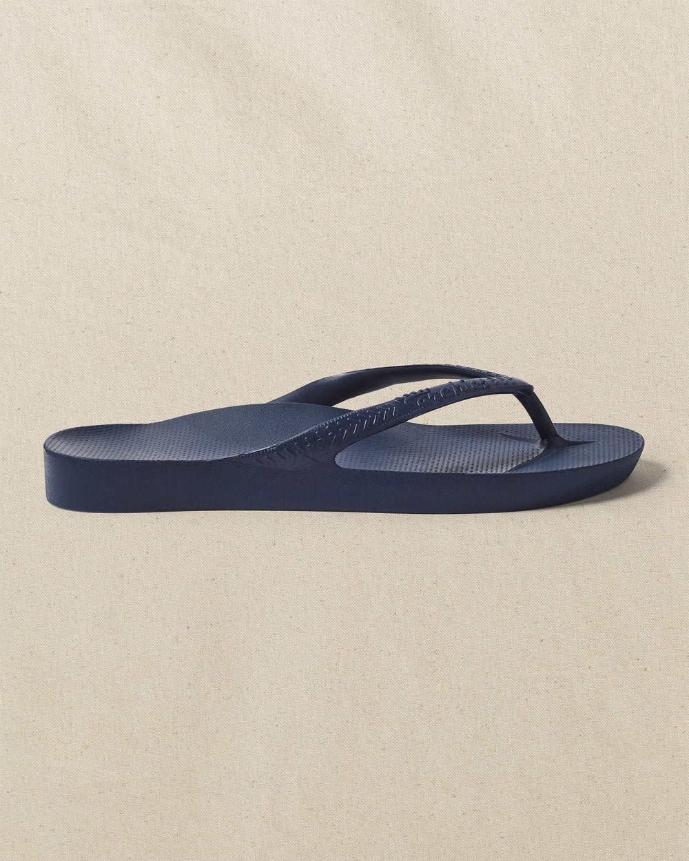 The right side view of the Southern Tide Archie's Navy Arch Support Flip Flop by Southern Tide - Navy