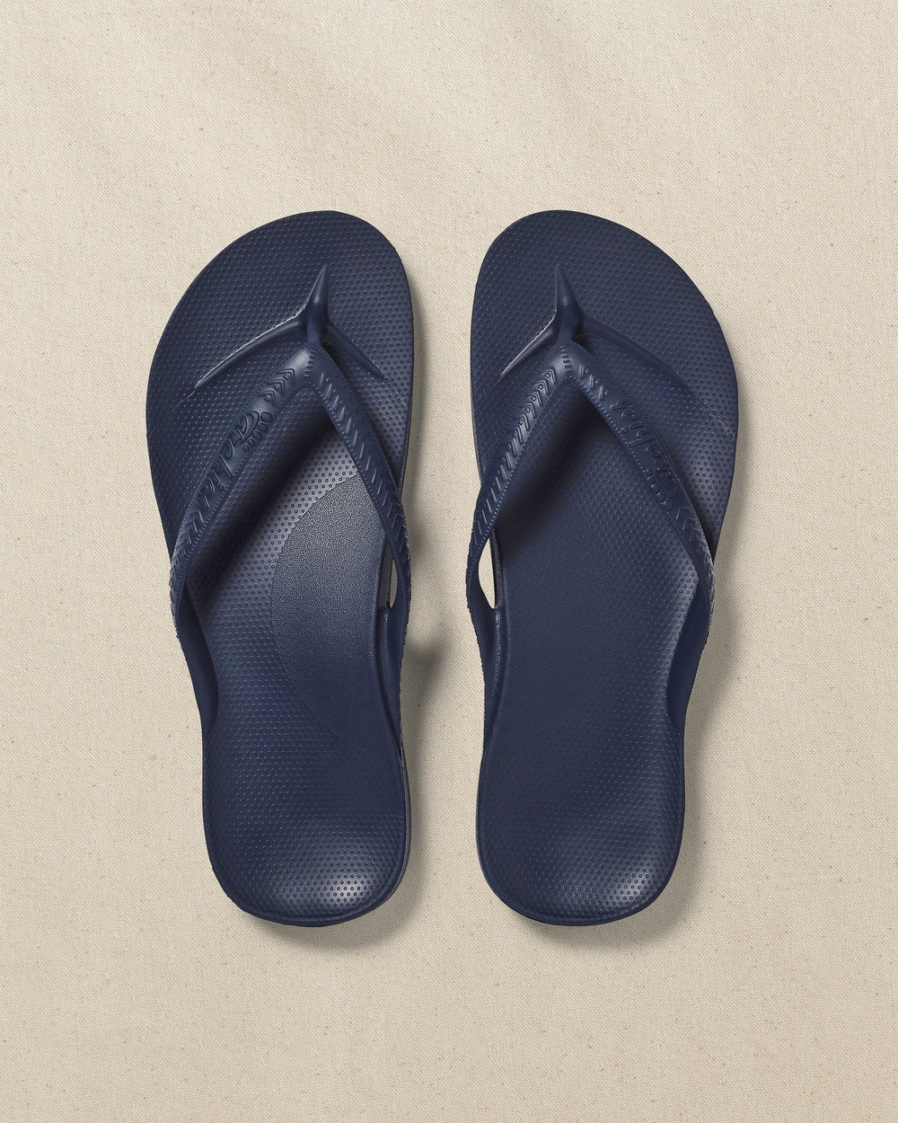 The top view of the Southern Tide Archie's Navy Arch Support Flip Flop by Southern Tide - Navy