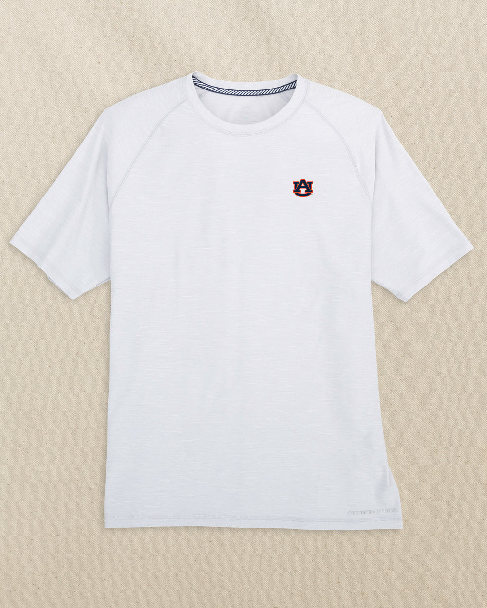 The front view of the Southern Tide Auburn Tigers brrr°®-illiant Performance T-Shirt by Southern Tide - Platinum Grey