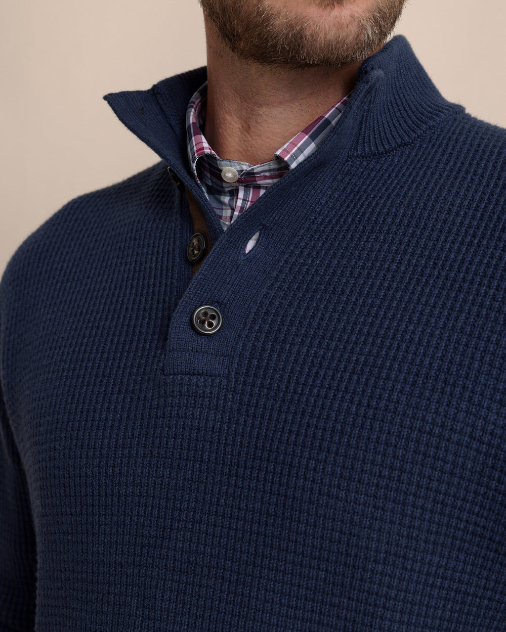 The detail view of the Southern Tide Bass Creek Heather Quarter Button Sweater by Southern Tide - Heather Dress Blue