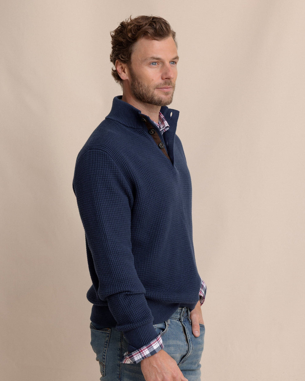 The side view of the Southern Tide Bass Creek Heather Quarter Button Sweater by Southern Tide - Heather Dress Blue