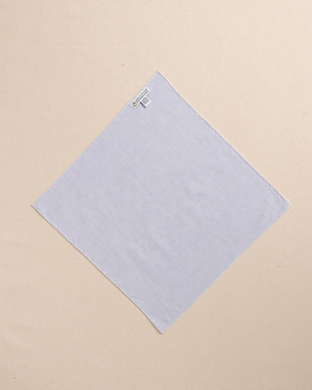 The back view of the High Cotton Blue Chambray Pocket Square at Southern Tide - Blue