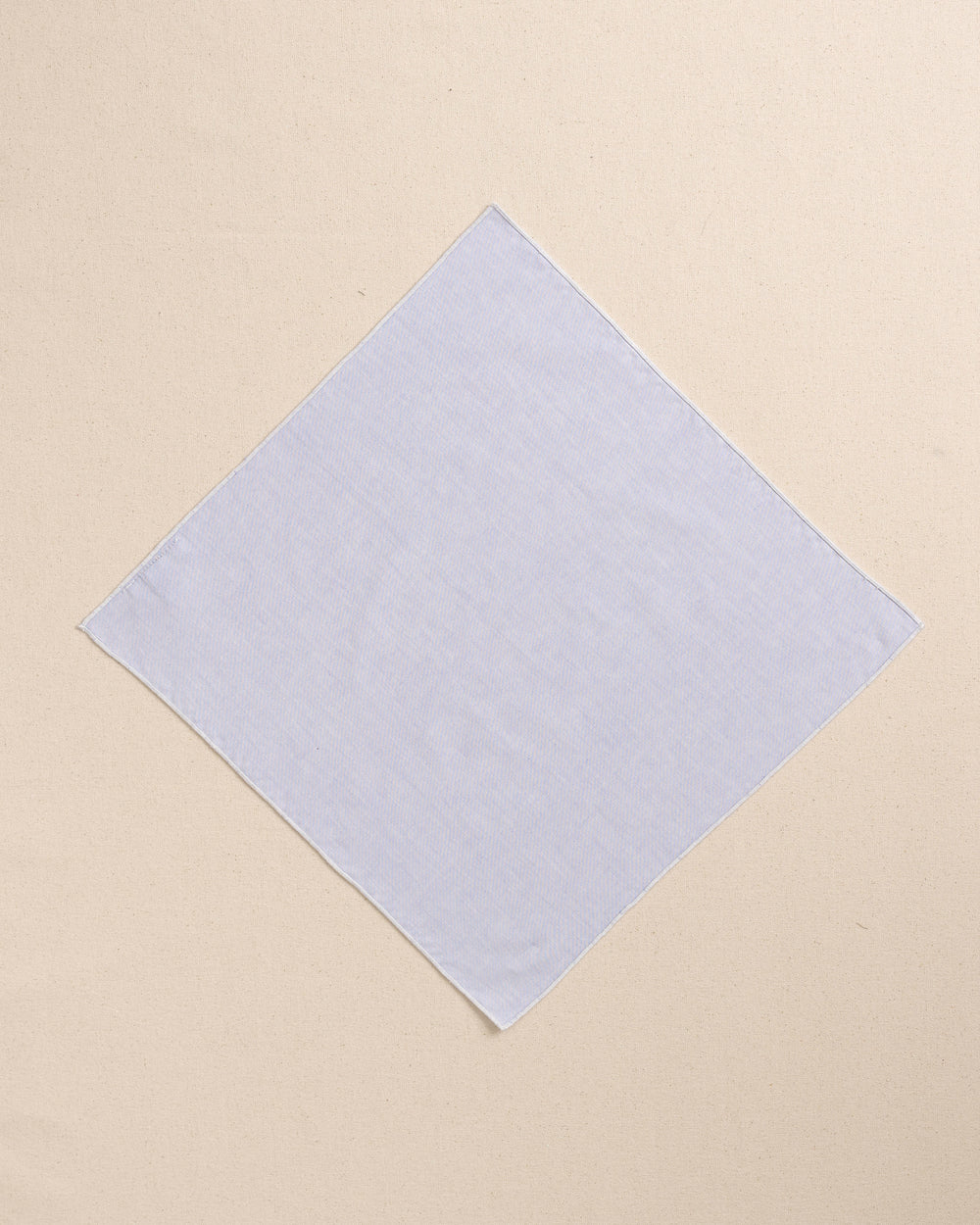 The front view of the High Cotton Blue Chambray Pocket Square at Southern Tide - Blue