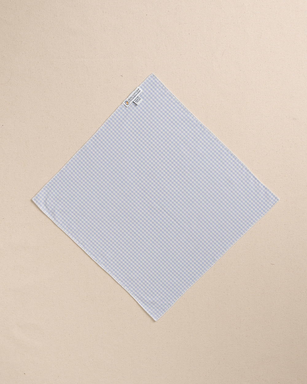 The back view of the High Cotton Blue Gingham Pocket Square at Southern Tide - Blue