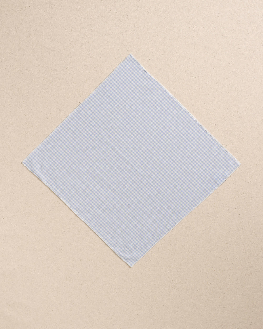 The front view of the High Cotton Blue Gingham Pocket Square at Southern Tide - Blue