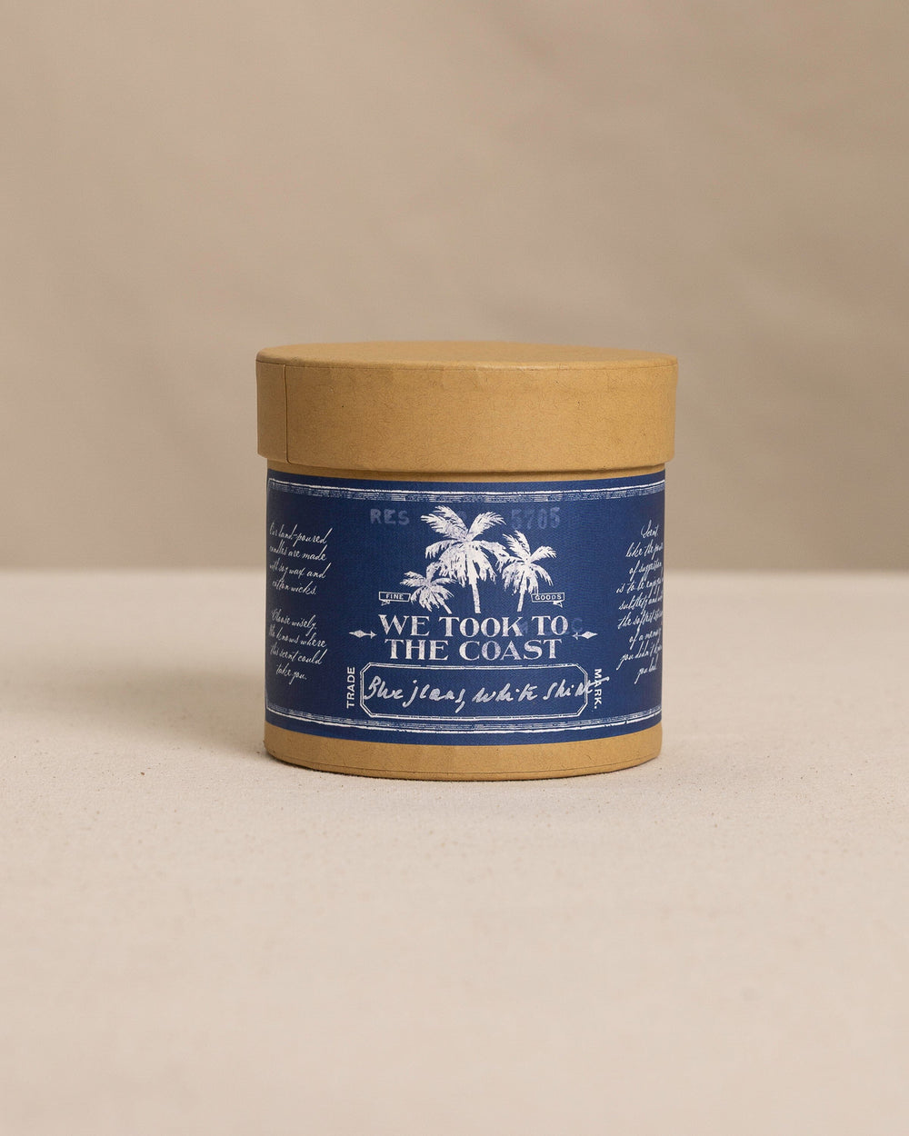 The front view of the We Took to the Woods Blue Jeans, White Shirt Candle at Southern Tide - White