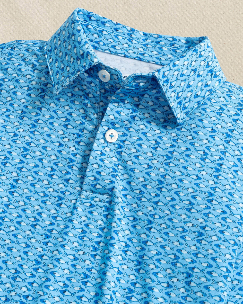The detail view of the Southern Tide Boys Driver Fish Printed Performance Polo by Southern Tide - Ocean Channel