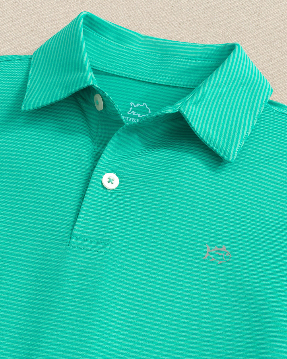 The collar view of the Southern Tide Boys Driver Meadowbrook Stripe Performance Polo by Southern Tide - Turtle Green