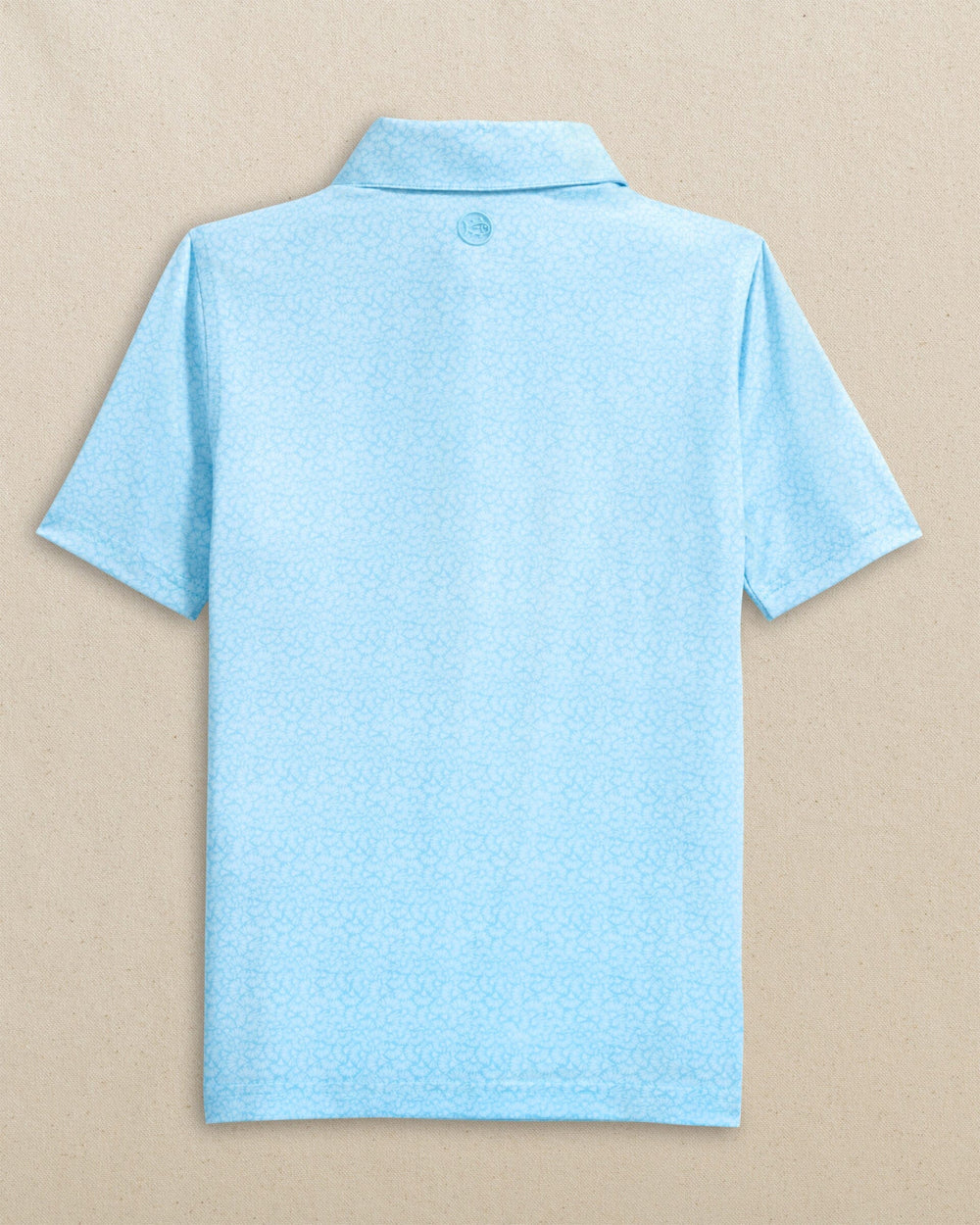 The back view of the Southern Tide Boys Driver Paradise Shores Printed Performance Polo by Southern Tide - Tropical Breeze Blue