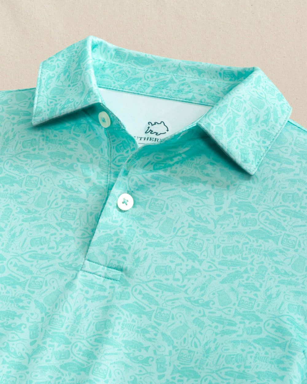 The detail view of the Southern Tide Boys Driver Seawatch Printed Performance Polo by Southern Tide - Shore Blue