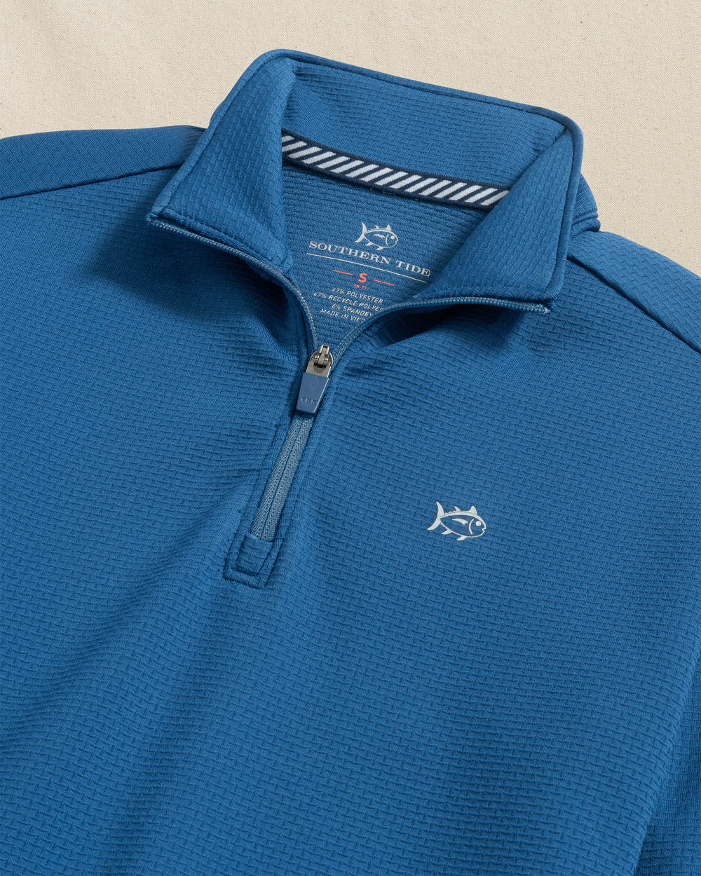 The detail view of the Southern Tide Boys Schooner Quarter Zip by Southern Tide - Nautical Blue