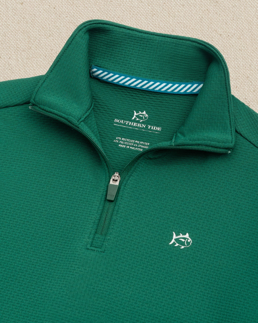 The detail view of the Southern Tide Boys Schooner Quarter Zip by Southern Tide - Salt Meadow