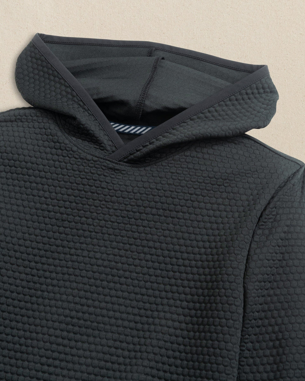 The detail view of the Southern Tide Boys Scuttle Hoodie by Southern Tide - Caviar Black 
