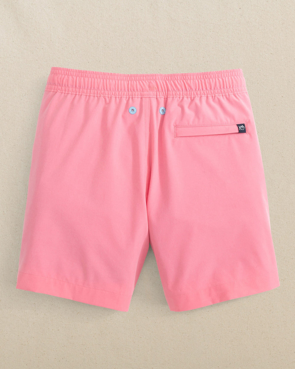 The back view of the Southern Tide Boys Solid Maritime Swim Trunk by Southern Tide - Sea Pink