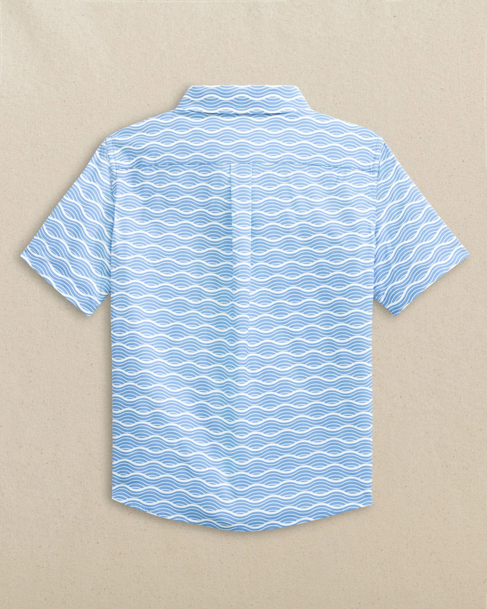 The back view of the Southern Tide Boys Waves Coastal Breeze® Short Sleeve Sport Shirt by Southern Tide - Ocean Channel