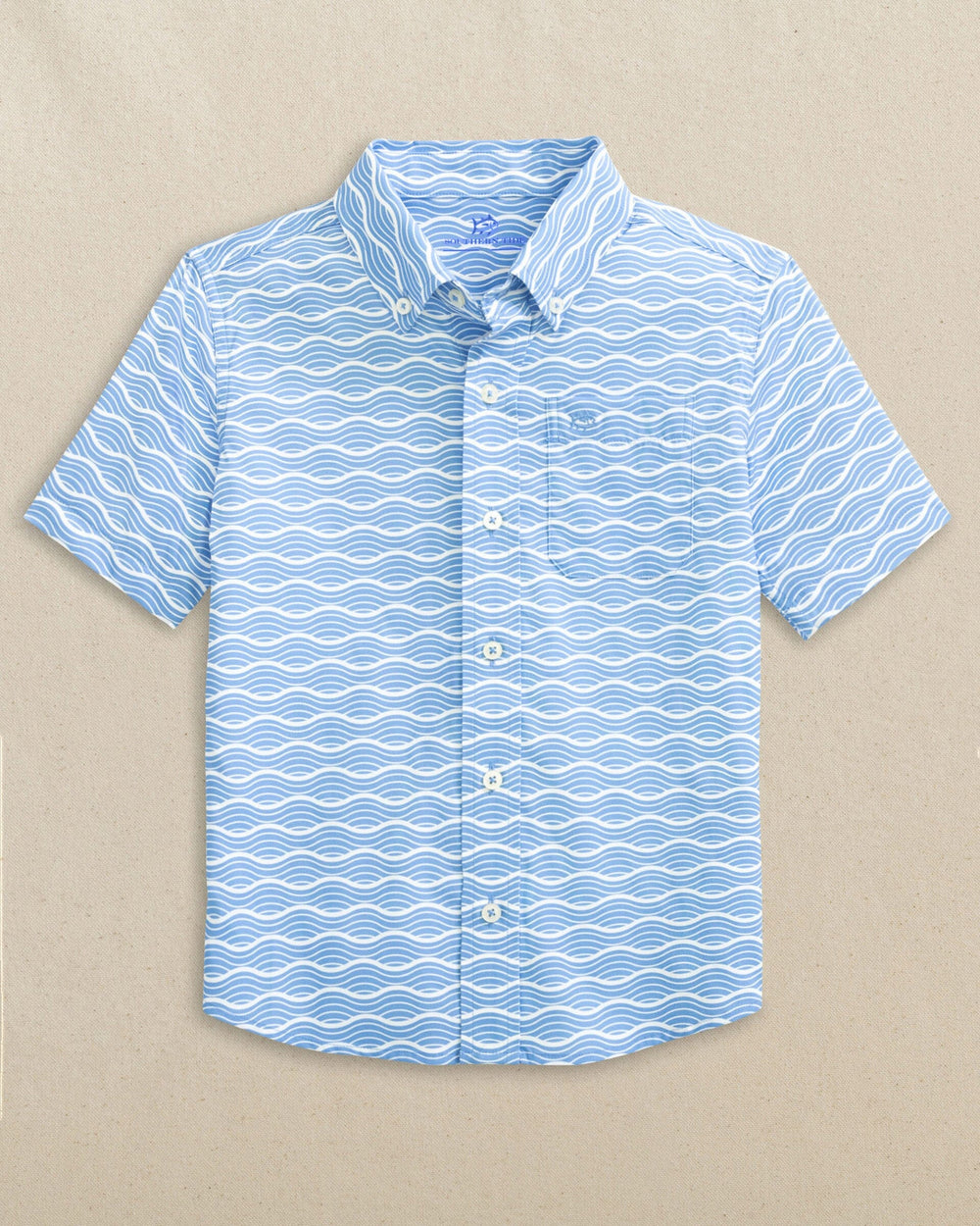 The front view of the Southern Tide Boys Waves Coastal Breeze® Short Sleeve Sport Shirt by Southern Tide - Ocean Channel