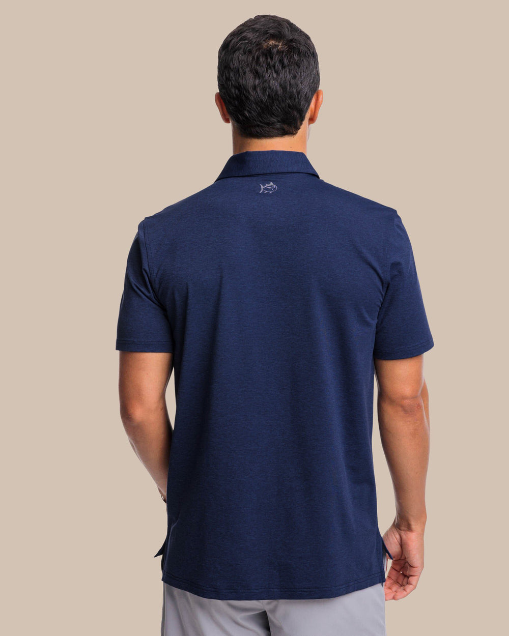 The back view of the brrr°®-eeze Heather Performance Polo Shirt by Southern Tide - Heather Nautical Navy