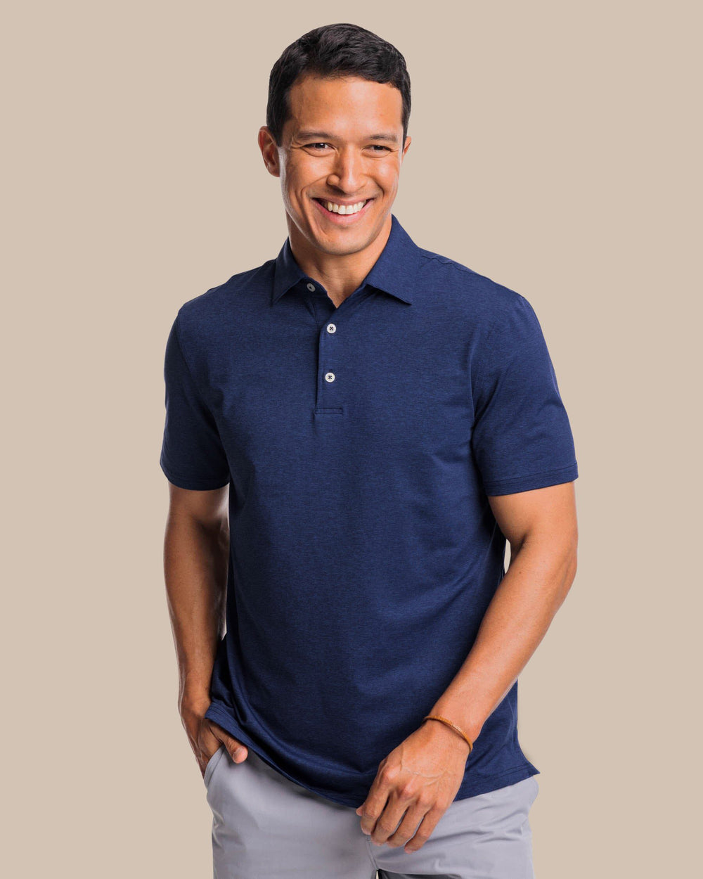 The front view of the brrr°®-eeze Heather Performance Polo Shirt by Southern Tide - Heather Nautical Navy