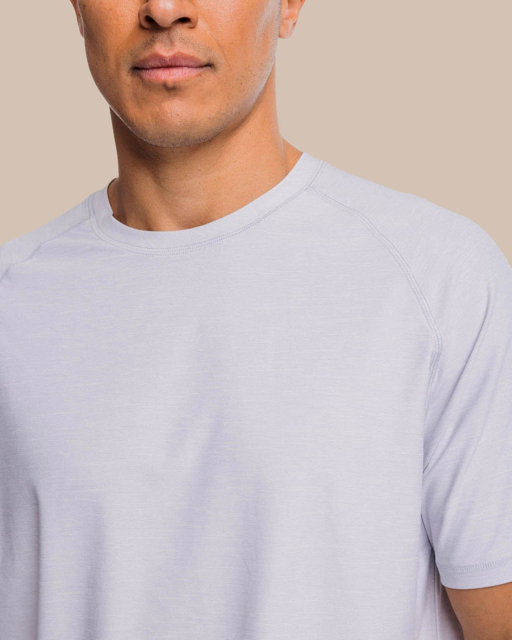 The detail view of the Southern Tide brrr°®-illiant Performance Tee by Southern Tide - Platinum Grey