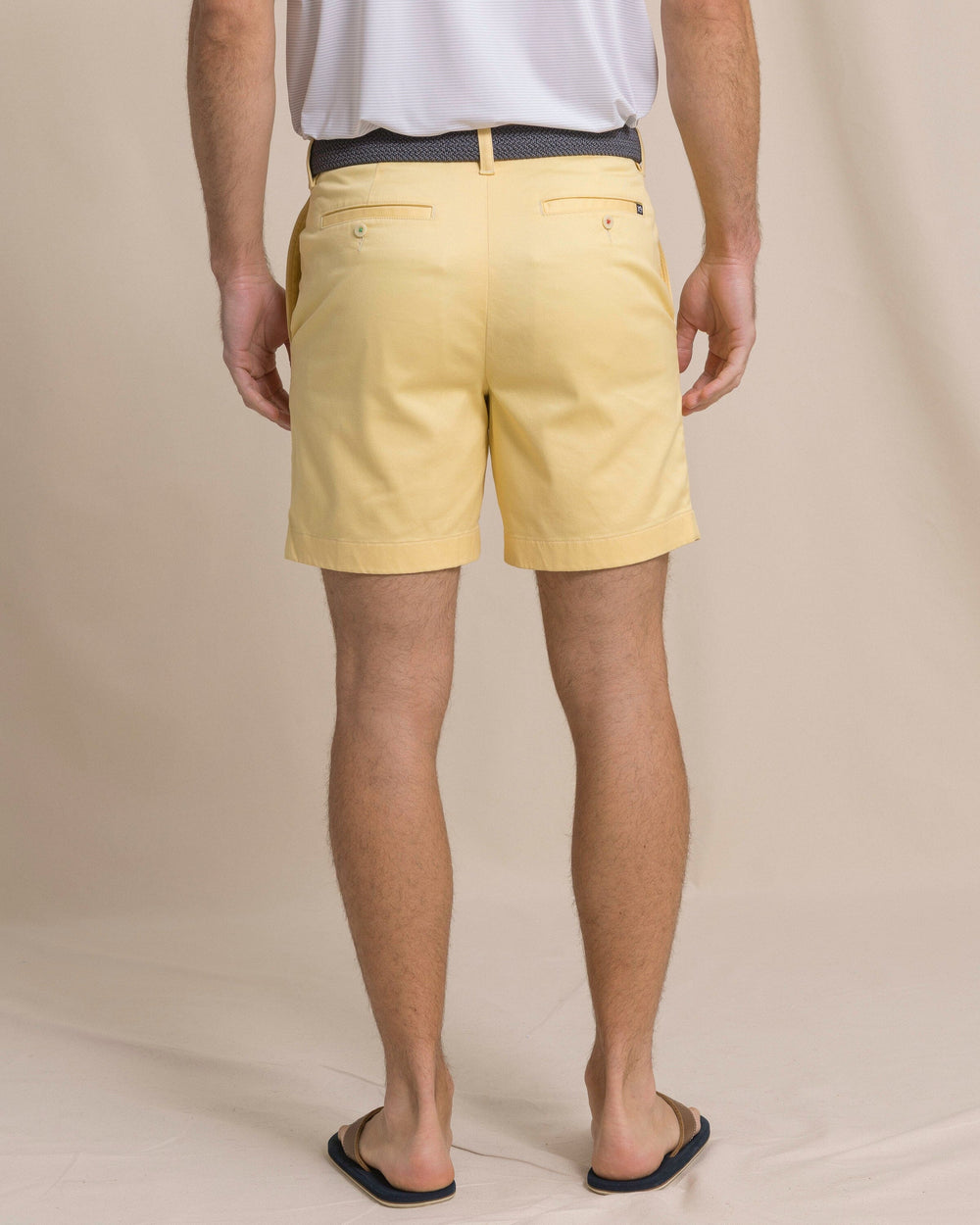 The back view of the Southern Tide Channel Marker 7" Stretch Chino Short by Southern Tide - Pineapple