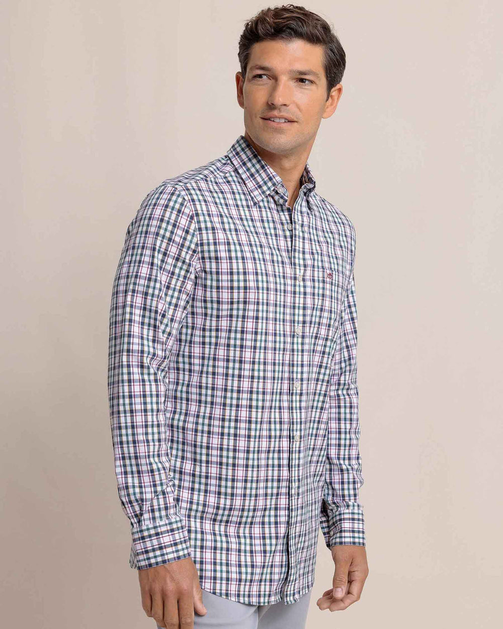 The side view of the Southern Tide Charleston Master Plaid Long Sleeve Sport Shirt by Southern Tide - Forest Biome
