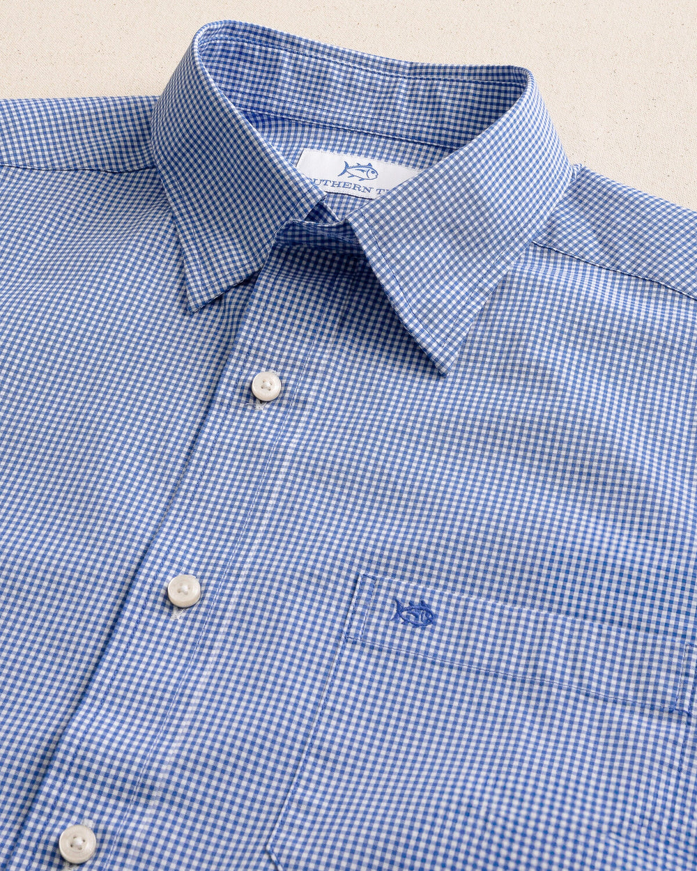 The detail view of the Southern Tide Charleston Parkwood Micro-gingham Embroidered Sport Shirt by Southern Tide - Cobalt Blue