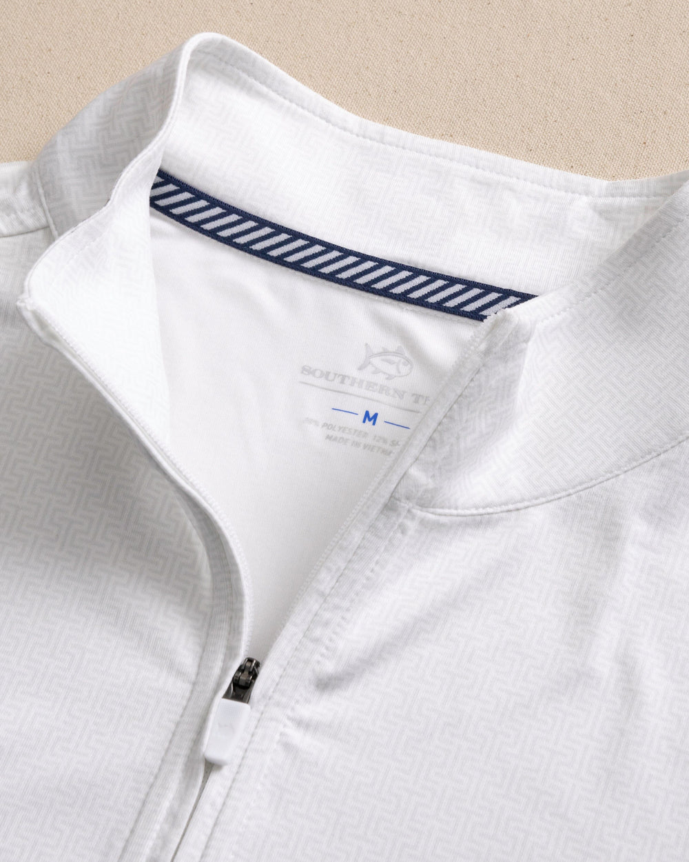 The detail view of the Southern Tide Clemson Tigers Cruiser ST Geo Printed Quarter Zip by Southern Tide - Classic White