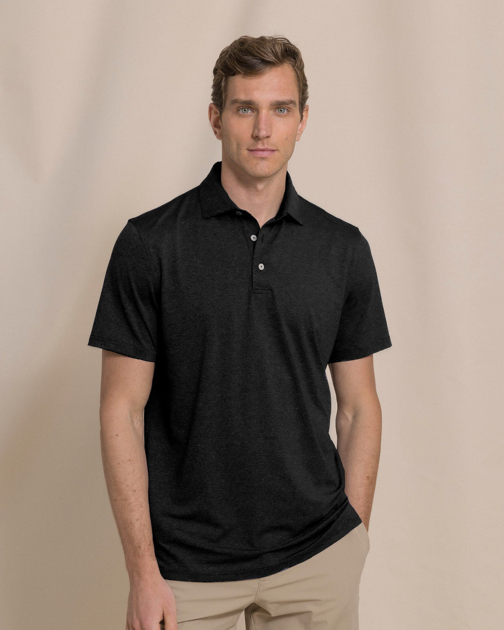 The front view of the Southern Tide Coastal Breeze® Heather Performance Polo by Southern Tide - Heather Caviar Black