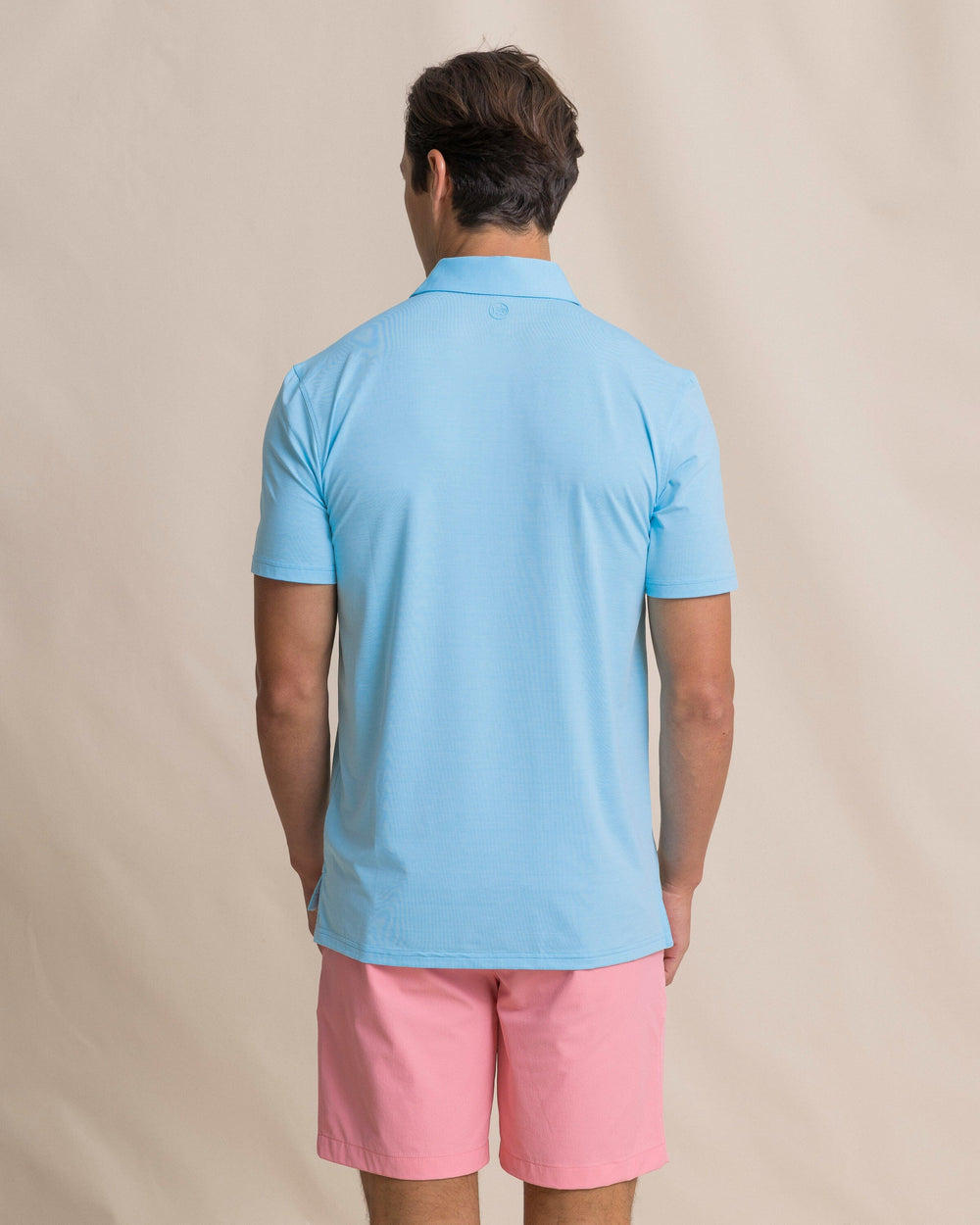 The back view of the Southern Tide Coastal Breeze® Heather Performance Polo by Southern Tide - Heather Ocean Channel