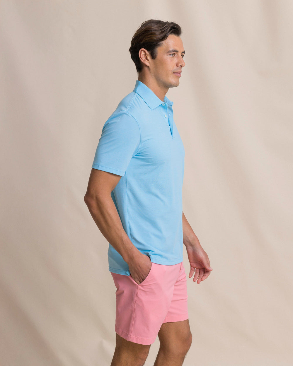 The side view of the Southern Tide Coastal Breeze® Heather Performance Polo by Southern Tide - Heather Ocean Channel