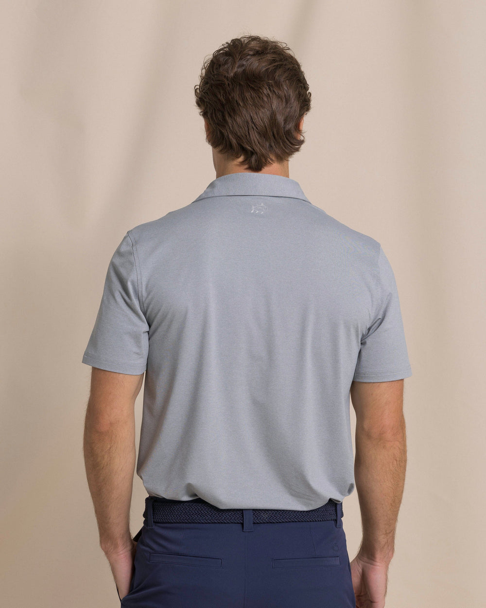 The back view of the Southern Tide Coastal Breeze® Heather Performance Polo by Southern Tide - Heather Steel Grey
