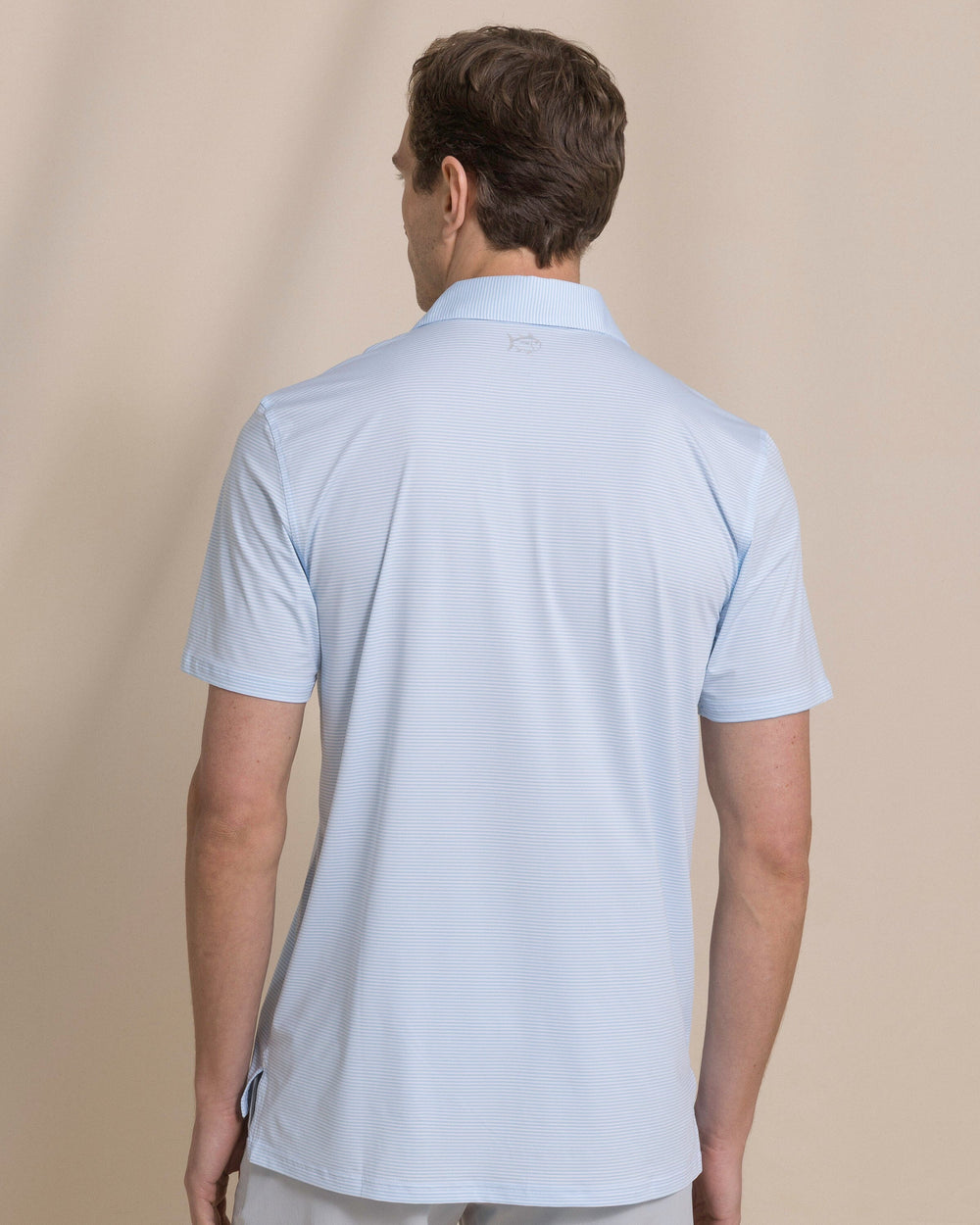 The back view of the Southern Tide Coastal Breeze® Meadowbrook Stripe Performance Polo by Southern Tide - Clearwater Blue