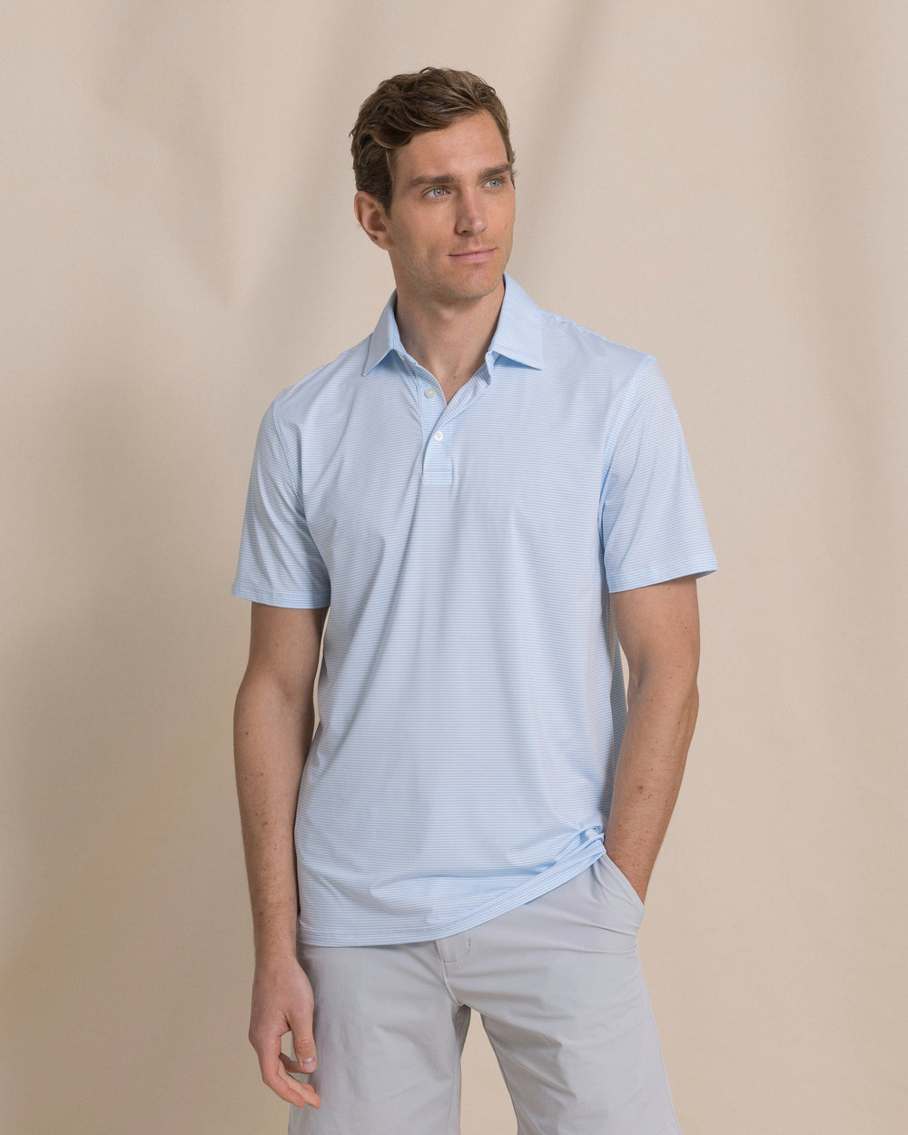 The front view of the Southern Tide Coastal Breeze® Meadowbrook Stripe Performance Polo by Southern Tide - Clearwater Blue