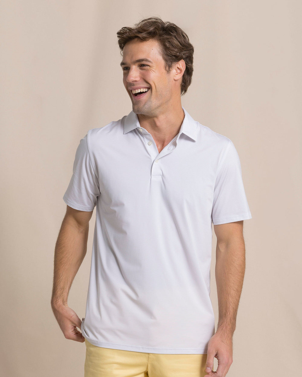The front view of the Southern Tide Coastal Breeze® Meadowbrook Stripe Performance Polo by Southern Tide - Platinum Grey