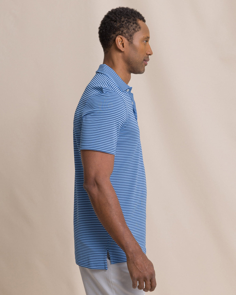 The side view of the Southern Tide Coastal Breeze® Oceanfront Stripe Pique Performance Polo by Southern Tide - Ocean Channel