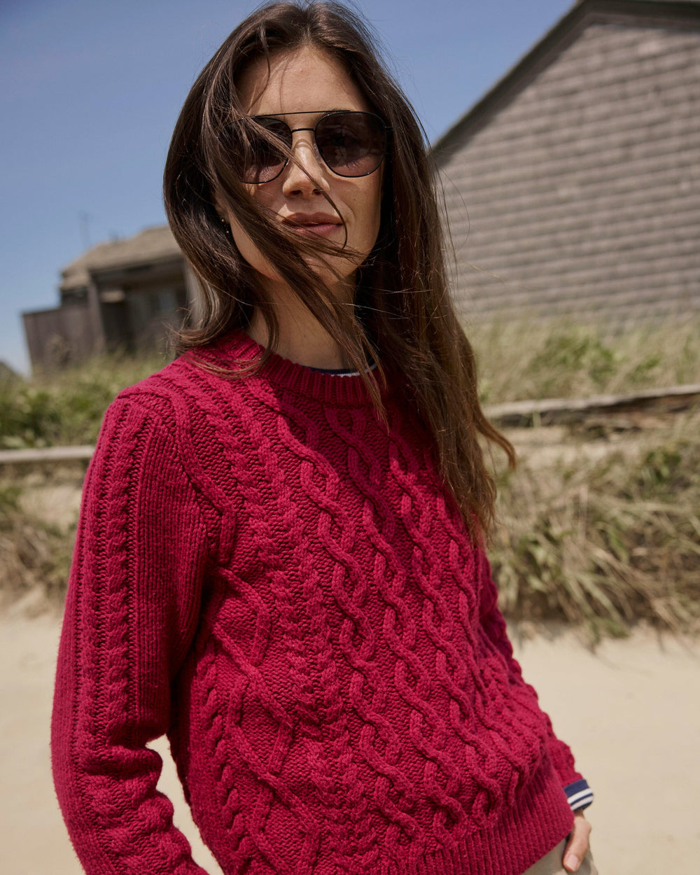 The lifestyle view of the Southern Tide Connie Cable Knit Sweater by Southern Tide - Carolina Plum