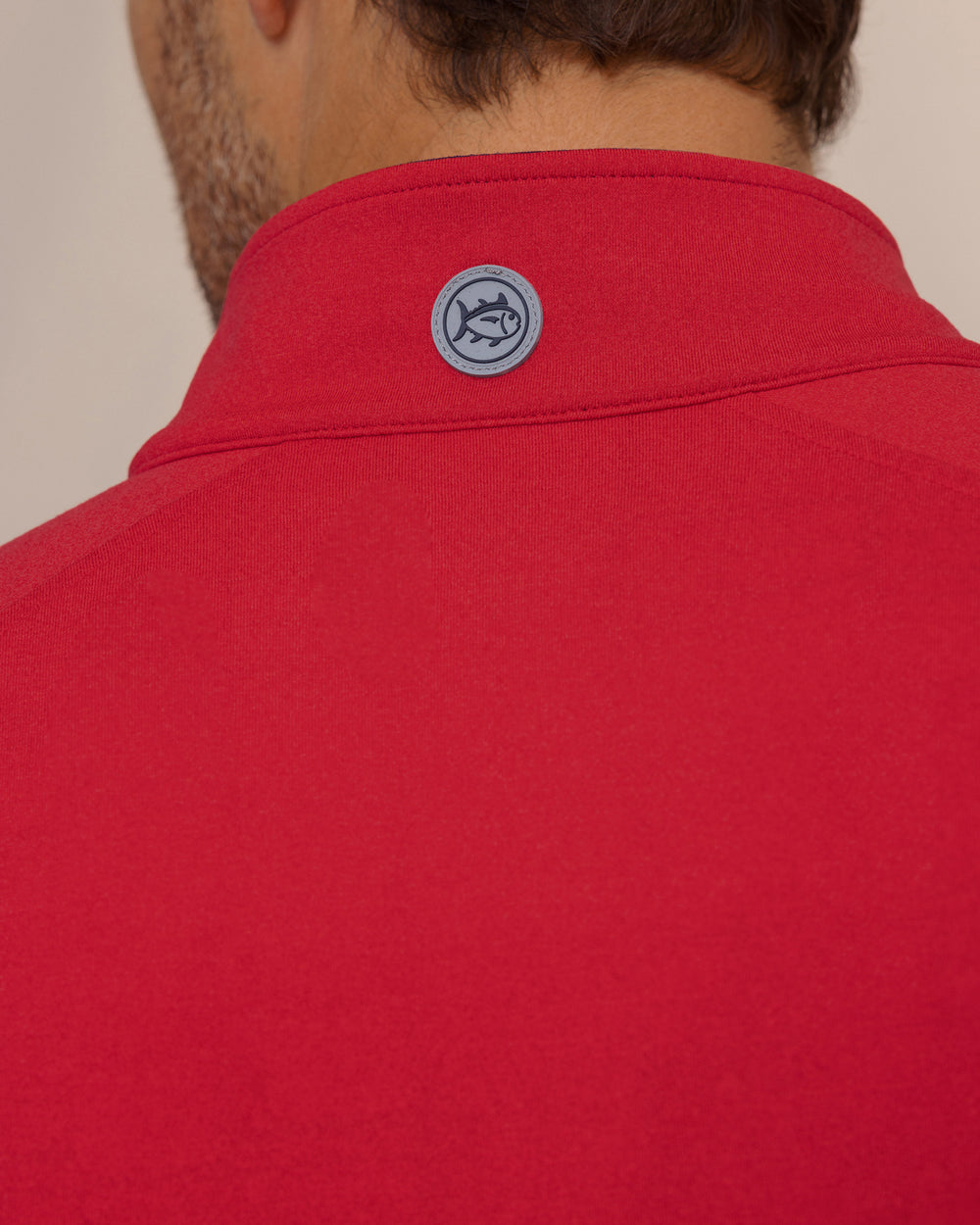 The detail view of the Southern Tide Cruiser Heather Quarter Zip Pullover by Southern Tide - Heather Crab Red