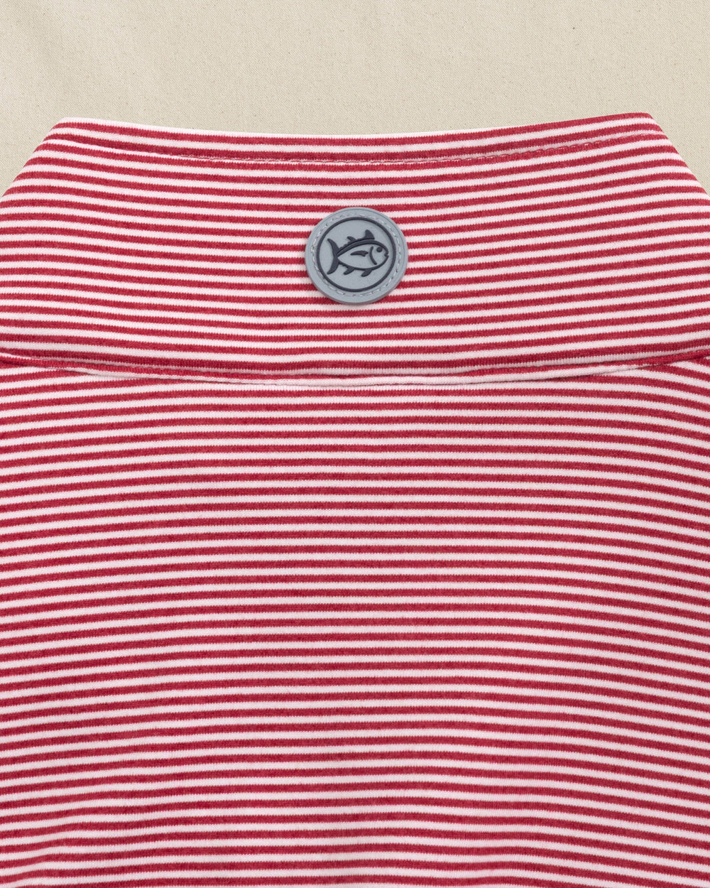 The detail view of the Southern Tide Cruiser Micro-Stripe Heather Quarter Zip by Southern Tide - Heather Crimson