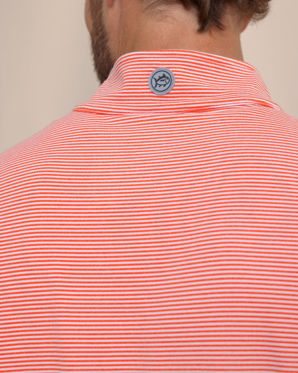 The detail view of the Southern Tide Cruiser Micro-Stripe Heather Quarter Zip by Southern Tide - Heather Endzone Orange