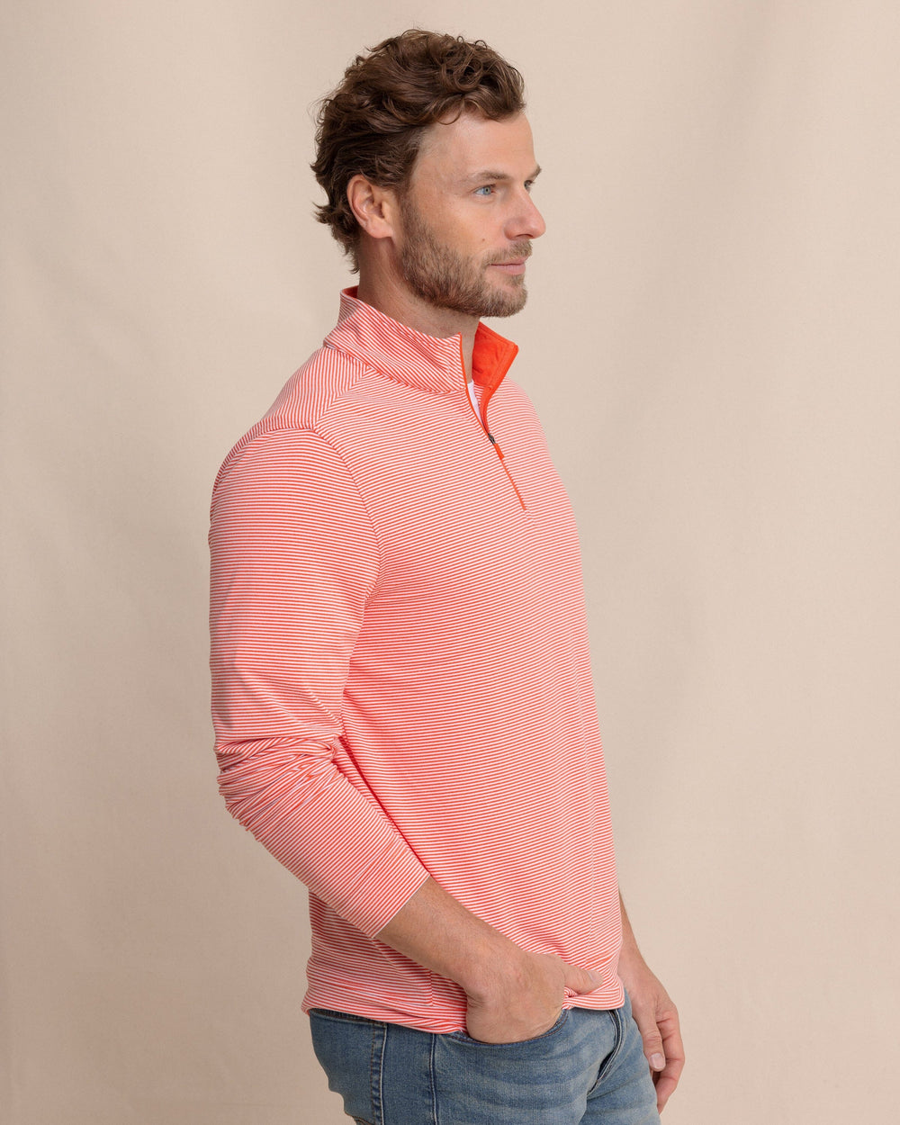 The side view of the Southern Tide Cruiser Micro-Stripe Heather Quarter Zip by Southern Tide - Heather Endzone Orange