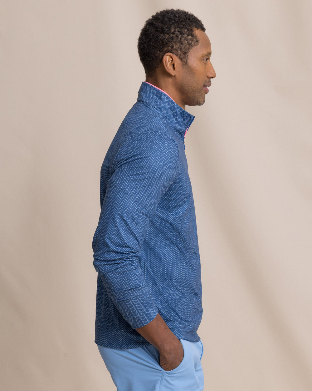 The side view of the Southern Tide Cruiser Raise The Par Printed Quarter Zip by Southern Tide - Nautical Blue