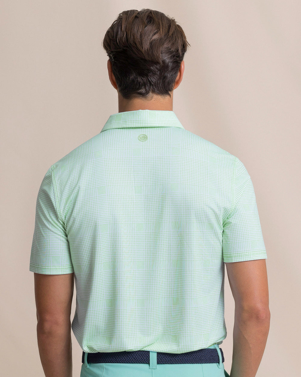 The back view of the Southern Tide Driver Coral Key Plaid Printed Polo by Southern Tide - Gulf Shores
