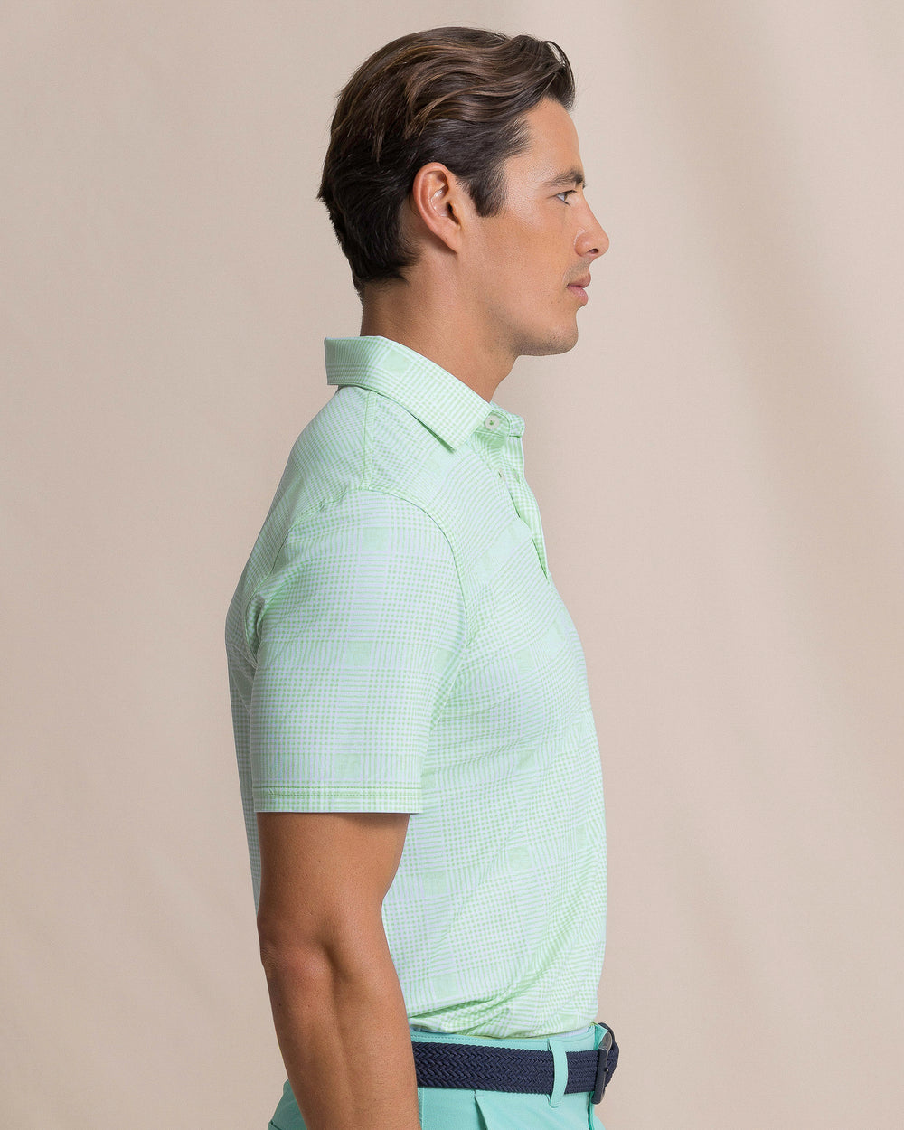 The side view of the Southern Tide Driver Coral Key Plaid Printed Polo by Southern Tide - Gulf Shores