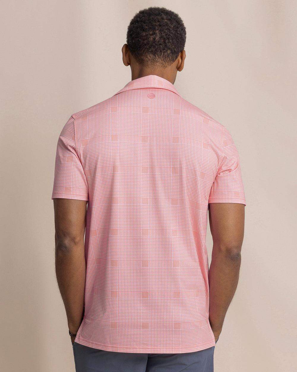 The back view of the Southern Tide Driver Coral Key Plaid Printed Polo by Southern Tide - Sea Pink