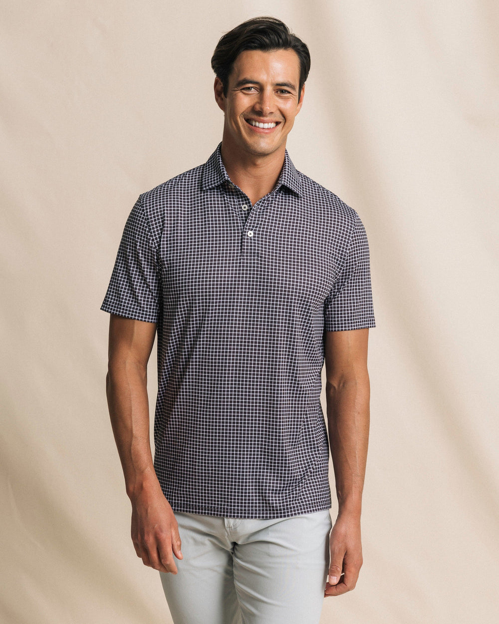 The front view of the Southern Tide Driver Dunes Edge Team Colors Plaid Polo by Southern Tide - Black